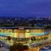 Minsk Marriott Hotel in Minsk with illuminated exterior and city skyline at dusk