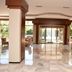 Anemon Ege Hotel in Izmir lobby with polished marble floors, wood accents and glass doors