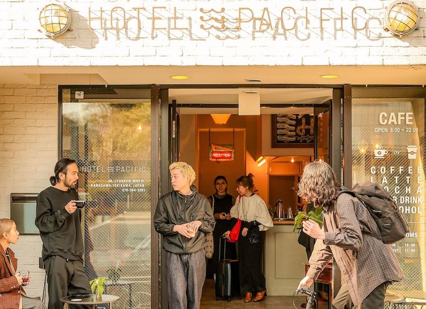 Hotel Pacific Kanazawa entrance with guests outside café in Kanazawa