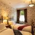 Rokeby Manor in Invergarry guest room with twin beds, floral wallpaper and a window view