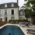 Maison de la Garenne & Spa in Vannes with an outdoor pool and lounge chairs beside the hotel