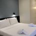 The Loom Rangsit in Pathum Thani hotel room with two beds and wall sconces