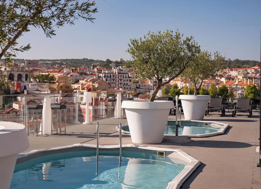 Vila Gale Opera Hotel Lisbon rooftop terrace with small pools and city views