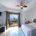 Maresca Hotel Praiano room with twin bed, sea-view balcony, and patio seating in Praiano