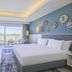 Hilton Skanes Monastir Beach Resort room with king bed, balcony, and sea view in Monastir