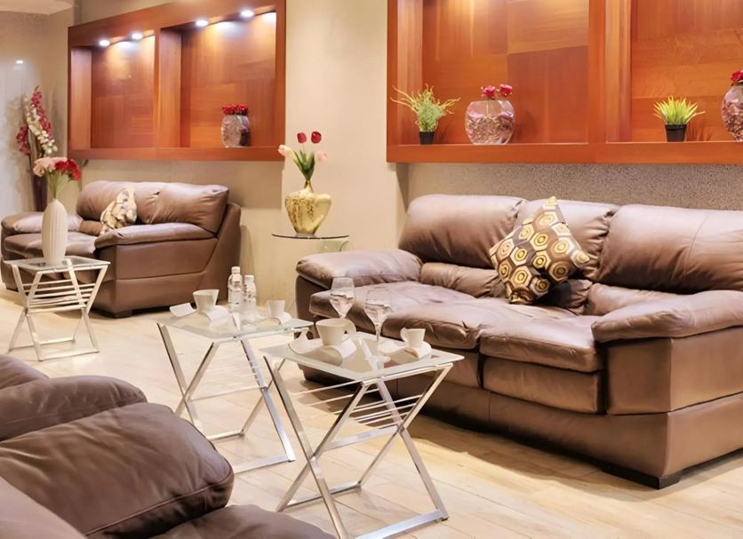 Barakat Burhan Hotel Mecca lounge with leather sofas and glass coffee tables