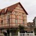 Hotel Le Canada in Hermanville-sur-Mer, half-timbered hotel building with tiled roof