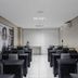 Citi Hotel Residence Caruaru meeting room in Caruaru with rows of black chairs and tables