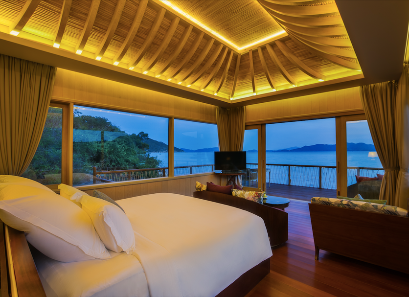 An Lam Retreats Ninh Van Bay bedroom with bay views and a private balcony in Thon Dam Van