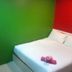 My Home Hotel Kuchai Lama in Kuala Lumpur: simple room with white bed, green wall and red desk