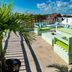 Hotel Boutique Rato 10 in Playa del Carmen rooftop terrace with lounge seating and tropical views
