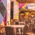 Ibiza Rocks Hotel in Sant Antoni de Portmany outdoor café seating with colorful mural wall and bar