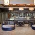 Wyndham Grand Orlando Resort Bonnet Creek lobby lounge in Celebration with round seating and coffee bar