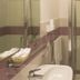 Rotte e Sentieri B&B in Castelluzzo bathroom with glass shower, sink, and towel rack