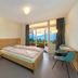 Crans-Montana Youth Hostel room with twin bed, private bathroom, desk and mountain view in Crans-Montana
