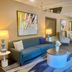 Comfort Inn Rutland - Killington lobby with blue sofa, lamps, seating area and staircase