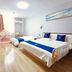 Super 8 by Wyndham Qingdao Jiaonan Heng Li Yuan room with two beds and a small play tent in Qingdao