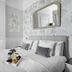 Sandway House, Torquay: elegant guest room with king bed, patterned wallpaper and wall mirror
