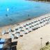 Akay Garden Family Club in Ildir, beachfront with sun loungers, umbrellas and swimmers in clear blue sea