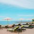 Tijili Hotel Benoa beach loungers facing the ocean in South Kuta