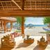 Rosewood Mayakoba in Playa del Carmen with open-air lounge facing a sandy beach and ocean view