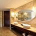 Beijing Marriott Hotel Northeast bathroom with double sinks, glass shower, and toilet in Beijing