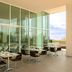 Fiesta Inn Morelia Altozano terrace dining area with glass walls and outdoor tables in Morelia