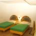 Hotel Maurya International in Chennai: twin beds with green bedspreads in a modest guest room