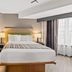 Country Inn & Suites by Radisson, Roanoke, VA guest room with king bed and large window