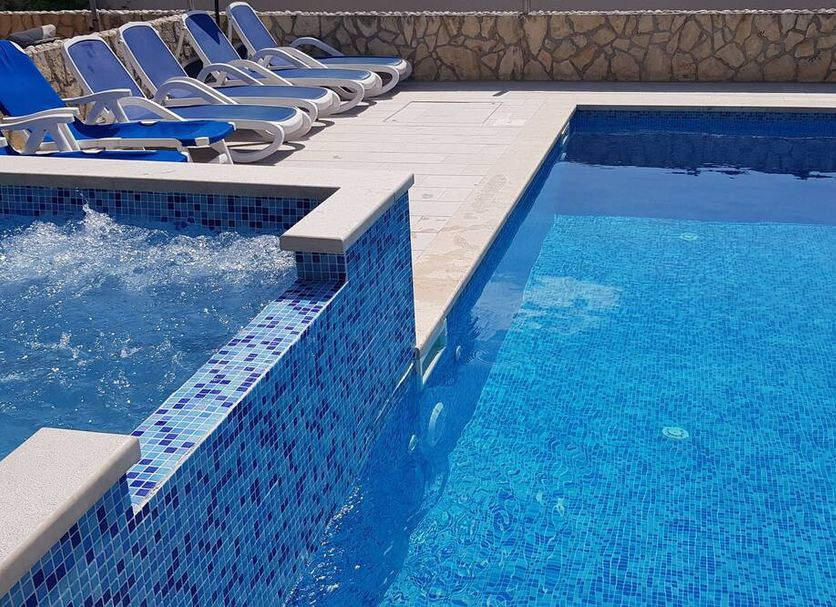 Apartments Antonio in Cavtat with outdoor pool, bubbling hot tub and sun loungers by the deck