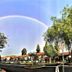 Laguna Hills Lodge in Laguna Hills with a rainbow over the hotel grounds and trees