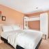 greet Hôtel Prévessin Genève Aéroport guest room with double bed and bunk bed, Prévessin-Moëns