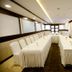 The Grand Radiant Hotel Lucknow conference room with U-shaped meeting tables and white-covered chairs
