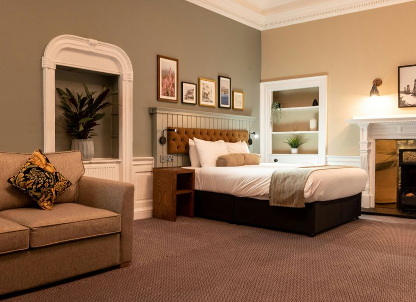 The Hawes Inn by Innkeeper's Collection in South Queensferry, guest room with sofa, bed and fireplace