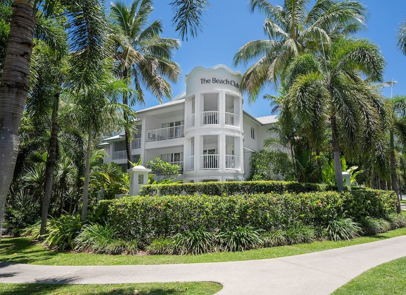 Peppers Beach Club Port Douglas hotel amid palm trees and tropical landscaping in Port Douglas