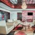 OYO Hotel Wade/Fayetteville I-95 South lobby with patterned armchairs, chandelier and round coffee table
