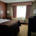 Baymont by Wyndham Midland Airport room in Midland with king bed and window seating area