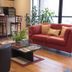 Fun City Resort Hotel in Burlington lounge with red sofa, armchair, coffee table and bar seating