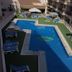 Águilas de los Collados in Águilas features an outdoor pool with sun loungers and umbrellas