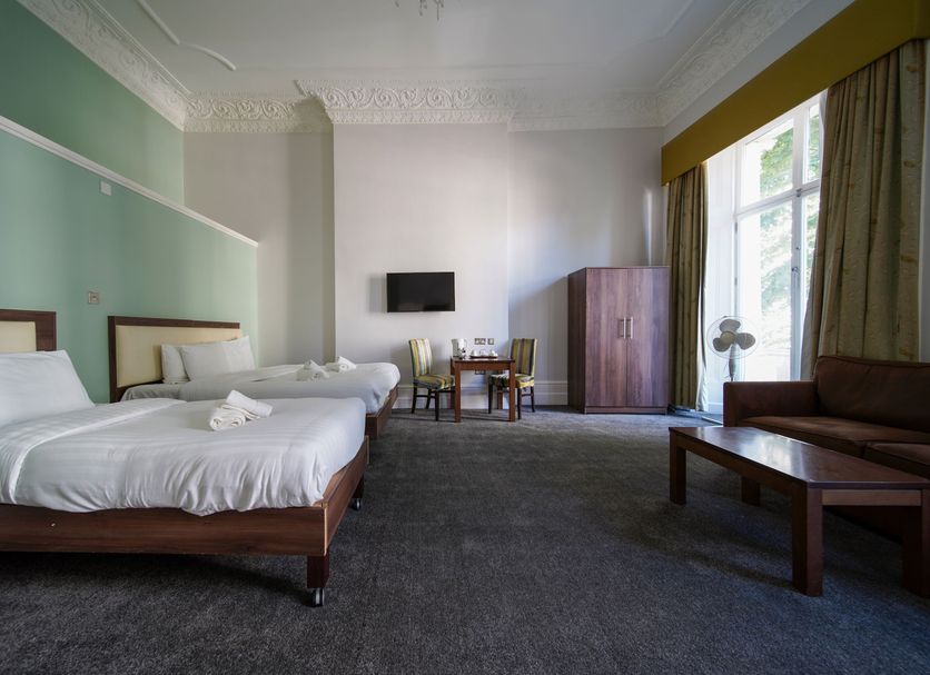 Hyde Park Boutique Hotel London room with twin beds, desk, wardrobe and large window