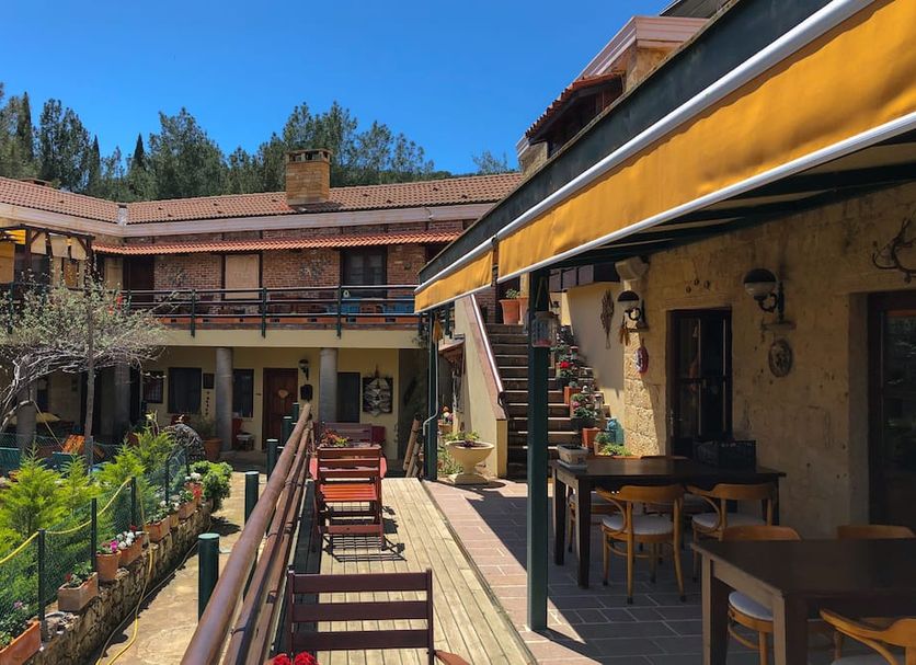 Kisik Konagi in Küçükkuyu courtyard with outdoor seating and covered terrace