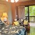 Maui What a Wonderful World Bed & Breakfast in Kīhei room with balcony view of palm trees
