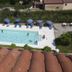 B&B Il Cavaliere in Santa Domenica with an outdoor pool, blue loungers and umbrellas