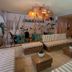 Hotel Barahona Cartagena lounge with striped benches, wood tables and TV in Cartagena
