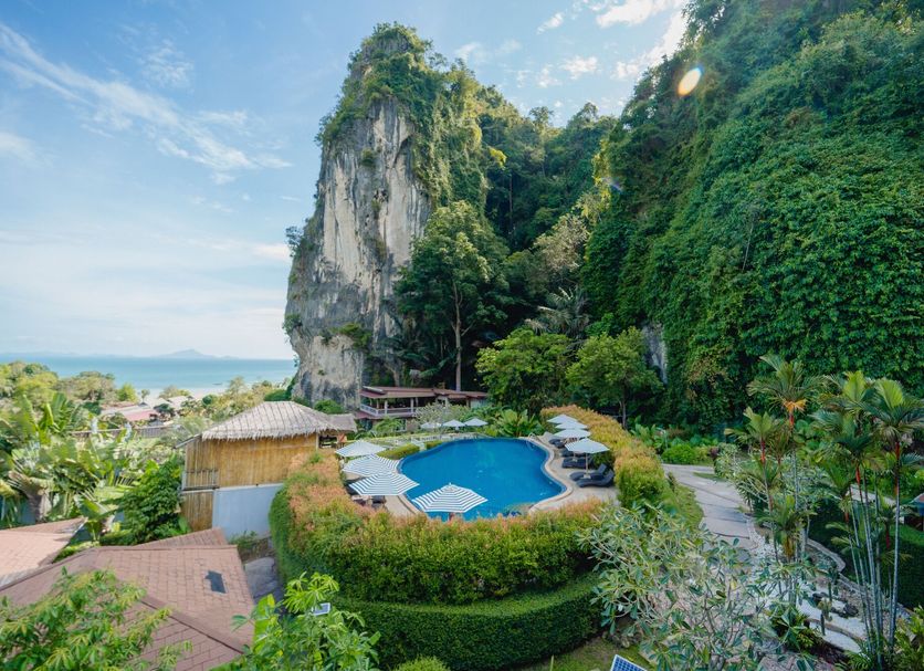 Railay Phutawan Resort in Ao Nang with cliffside pool and lush tropical hillside views