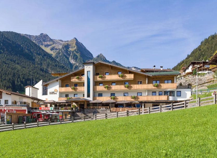 Hotel Panorama in Finkenberg with mountain views and a grassy foreground