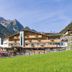 Hotel Panorama in Finkenberg with mountain views and a grassy foreground
