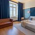 The Editory Riverside Hotel, Lisbon room with king bed, blue accents and a window view