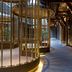 Guanyin Yiyuntai Hotel Chengdu interior corridor with gold cage-like decor and warm lighting