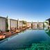 BLESS Hotel Madrid rooftop infinity pool with lounge chairs and city views in Madrid